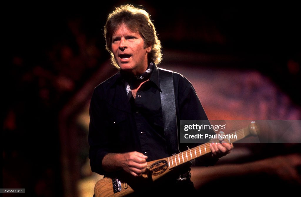 John Fogerty's "Rockin' All Over the World" from his 1975 self-titled solo album, charting at Billboard No. 27 before becoming a global stadium anthem