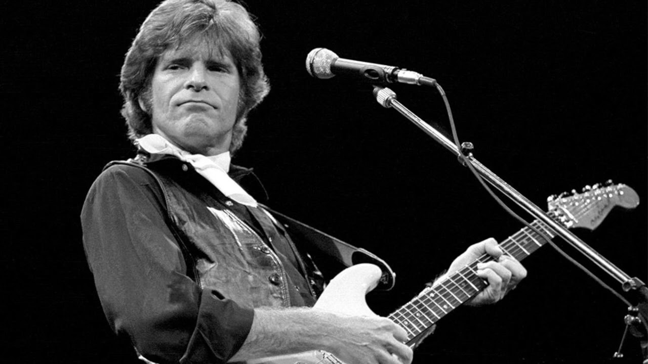 Creedence Clearwater Revival's "Cross-Tie Walker" from the 1969 album Green River featuring John Fogerty's acoustic hobo narrative